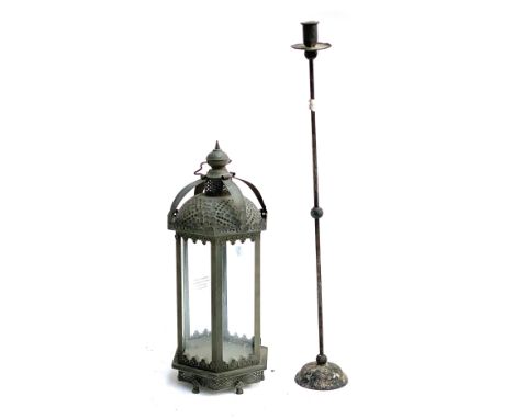 A metal hexagonal lantern, 51cmH; together with a metal candlestick, 77cmH 