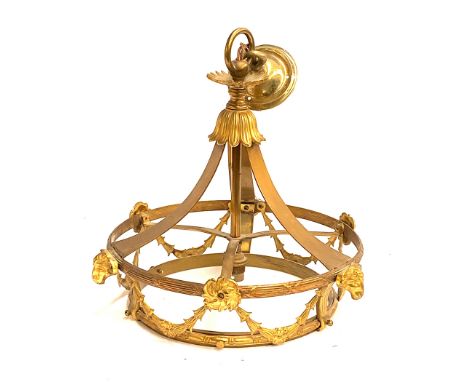 A gilt metal hanging light with ram masks and bellflower swags, missing glass shade, 33cmD 