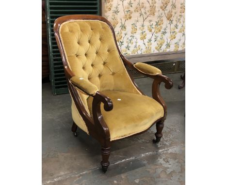 A 19th century mahogany button back open armchair, on turned legs and casters; together with square back upholstered side cha