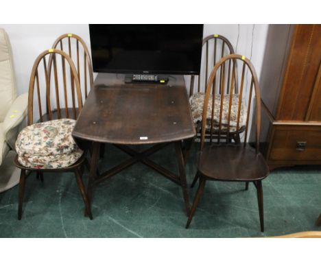 Four dark oak Ercol chairs and drop leaf table