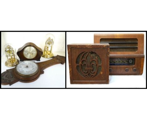 ETRONIC WALNUT CASED RADIO
of shaped outline with an upper speaker and multi coloured glass tuning band window, with four dia