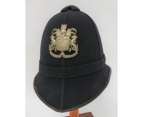 Cambridge Borough Police Helmetblack melton, six panel crown.  Pointed peak and rounded rear brim, all with black patent leat