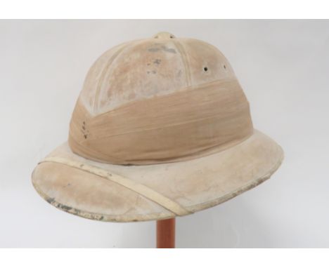 Early 20th Century Pith Helmet By Hawkescream khaki, six panel crown.  Rounded brim with leather edging.  Multi fold, linen p