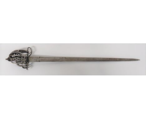 Late 19th Century Scottish Broadsword33 1/4 inch, double edged, wide blade with narrow central fuller.  The forte with Ordnan