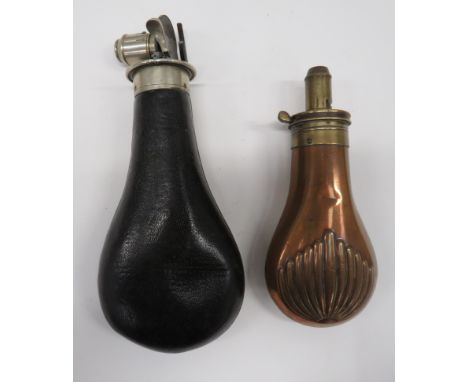 Two Various Powder Flasksconsisting 3/4 scale, 4 1/2 inch, copper body with fluted shell design to both sides.  Brass top wit