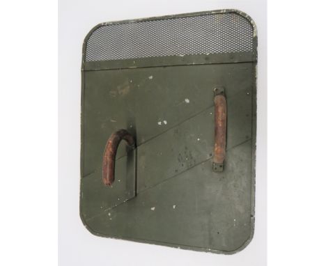 Early Post War British Army Riot Shieldgreen painted, rectangular alloy shield.  The top with mesh visor.  Rear fitted with l
