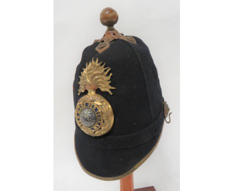 Royal Marine Artillery Officer's Home Service Helmetdark blue, melton, four panel crown.  Front rounded peak with brass edgin