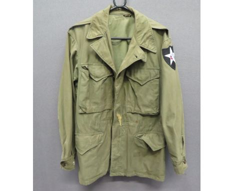 American M1943 Field Jacketgreen, heavy cotton, single breasted jacket.  The front fastened by composite buttons.  Bag chest 