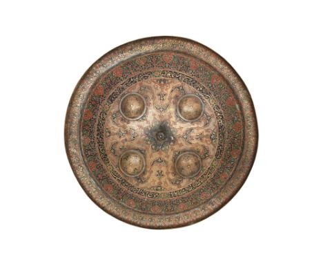A KASHMIRI ENGRAVED AND POLYCHROME ENAMELLED BRASS SHIELD (DHAL)Kashmir, Northern India, dated 1302 AH (1884 AD)Of typical co