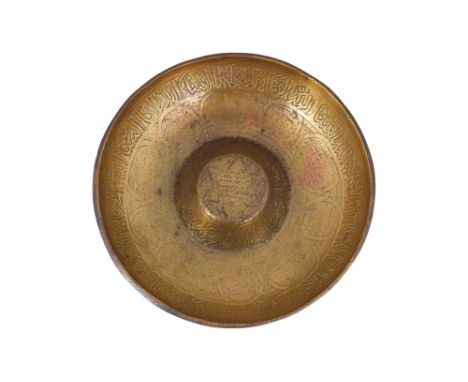 AN ENGRAVED BRASS 'MAGIC' BOWL WITH SIX-POINTED STAR Possibly Syria, late 15th - early 16th centuryOf typical shallow rounded