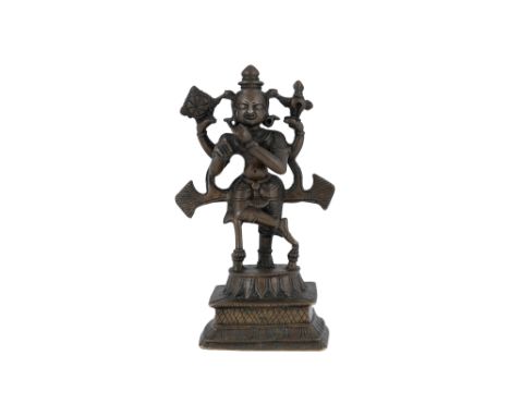 A BRONZE FIGURINE WITH KRISHNA PLAYING THE FLUTE Possibly Bengal or Kashmir, Himalayan Foothills, Northern India, 18th - 19th