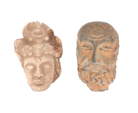 TWO MINIATURE GANDHARAN HEADS Ancient regions of Gandhara and Fondukistan, modern-day Afghanistan, 3rd - 4th centuryComprisin