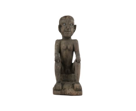 A RARE NAGA KONYAK TRIBE CARVED WOOD FEMALE FIGURE  Nagaland, Eastern Himalayas, North-Eastern India, 20th centuryCarved in t