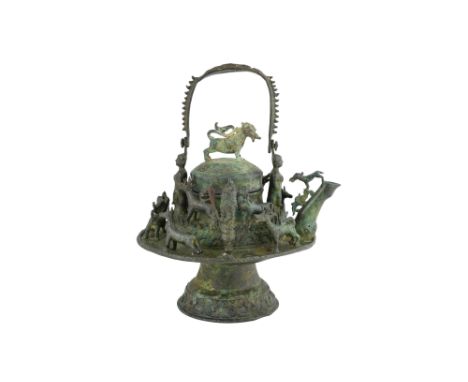 A LARGE BRONZE MALAY BORNEO RITUAL KETTLE WITH ANIMALS AND GUARDIAN FIGURES Possibly Brunei or Sarawak state, Borneo Island, 
