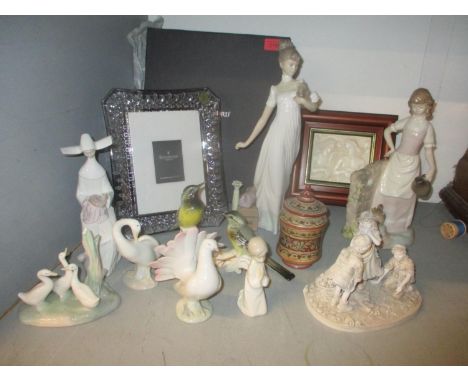 Lladro, Nao and other figures and model birds along with a Waterford Crystal photograph frame, boxes 