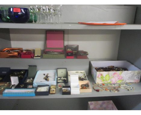 A selectin of 20th century costume jewellery to include a white metal choker, a simulated green jade and mother of pearl neck