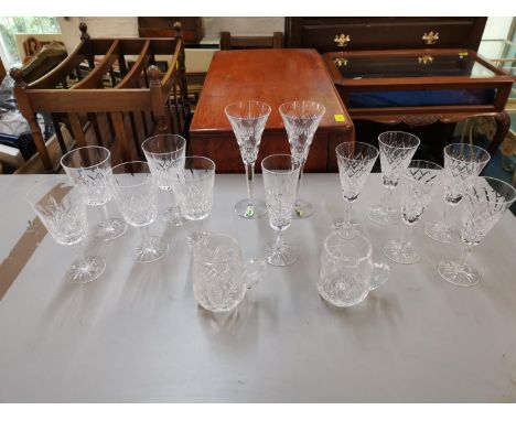 Waterford Crystal to include a pair of champagne flutes, two sets of five wine glasses, a single wine glass and a pair of tan