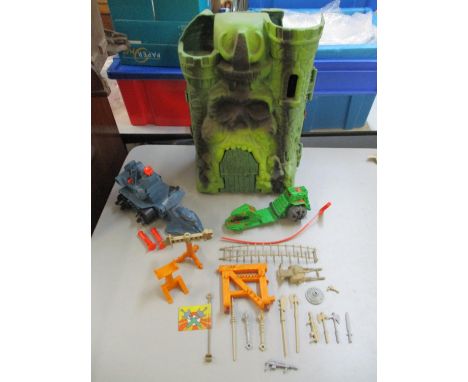 A vintage 1980's Masters of the Universe Castle Grayskull with accessories together with Road Ripper and Battle Ram with all 