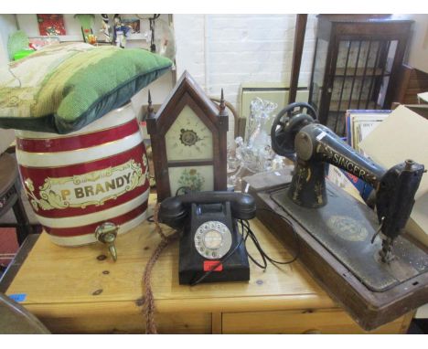 A mixed lot to include a mid 20th century black ATM Bakelite telephone, an early 20th century Singer sewing machine F series,