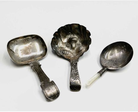 A silver caddy spoon by Ledsam, Vale &amp; Wheeler Birmingham 1827, another with fruit to the bowl (holed) and a third silver