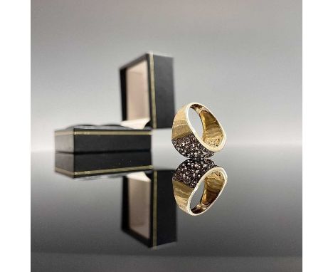 A post-war 9ct yellow gold ring set with diamonds in a pierced geometric band within diamond lines Size K/L 4gm