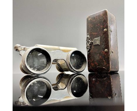 A papier-mache snuff box dated 1858 to a silver escutcheon 9cm long and a pair of aluminium and mother-of-pearl opera glasses