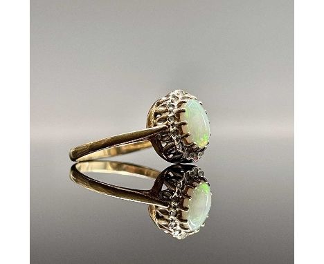 A 9ct gold opal cluster ring with tiny diamonds Size Q 2.5gmCondition report: The opal measures 5.84x7.75mm 2.27mm deep Minor