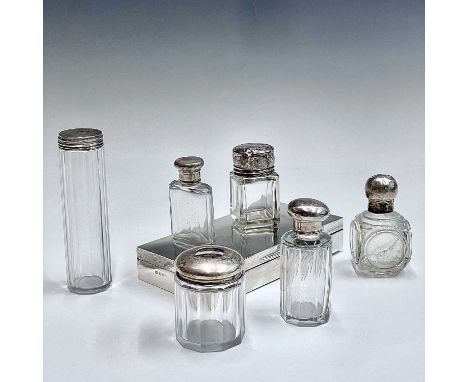 A small Edwardian cut glass flask with silver lid, an Edwardian Chester marked glass salts jat with silver engraved top and f