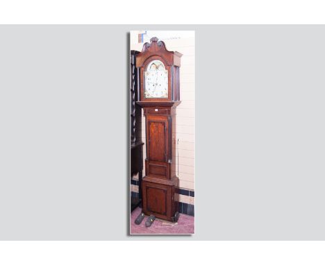 A 19th Century oak and mahogany longcase clock with arched twin swan pediment hood, single arched top glazed door flanked by 