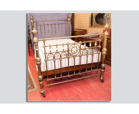 A good Victorian brass bedstead with mother of pearl and copper decorated end brass column and bulbous reeded repousse decora