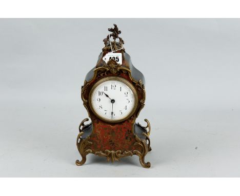 A small French Louis XV style boulle mantel clock, late 19th Century in an ebonized case, 12 ins (30.5 cms) high, (missing in
