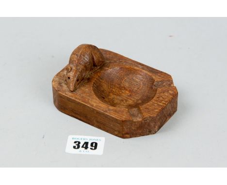 An oak Robert Mouseman Thompson carved ashtray with signature mouse, 4.25 ins (11 cms) in length