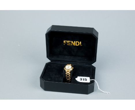 A lady's cased and boxed gold plated circular dial Fendi wristwatch having a mother of pearl dial with sweep seconds movement