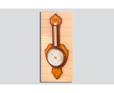 An Edwardian mahogany and inlaid aneroid barometer, the shaped banjo style wooden background inlaid with floral and swag boxw