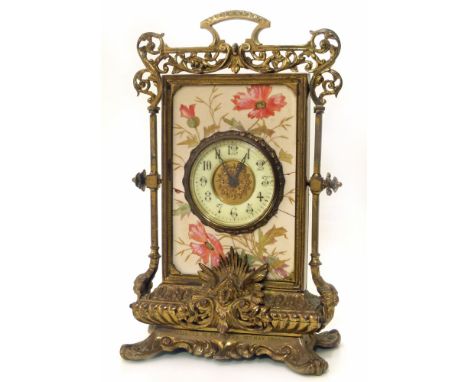A continental gilt metal mantel clock with painted ceramic panel. Movement has been replaced with quartz. Condition reports a