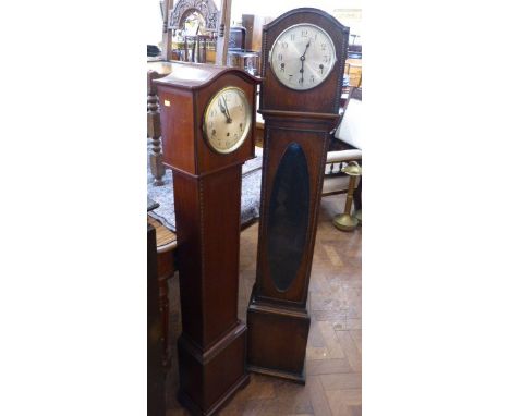 An English grandmother clock and a French grandmother clock Condition reports are not available for our Interiors sales.
