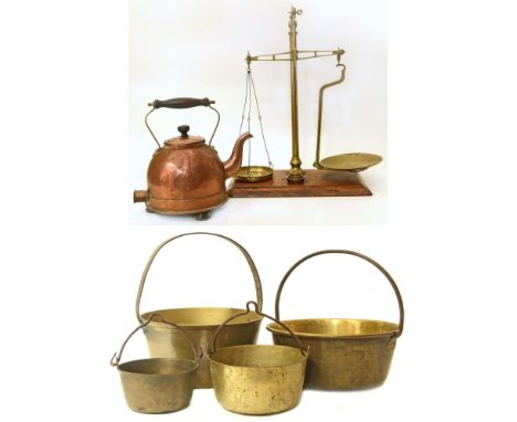 A set of brass balance scales complete with five graduated weights, a vintage copper kettle and four brass jam kettles Condit