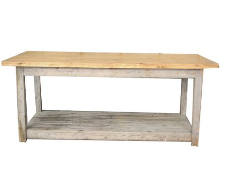 A rustic pine plank top work table The rectangular plank top supported on substantial square section supports with a slatted 