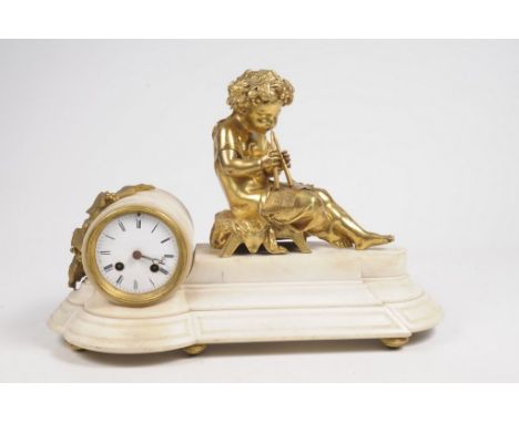 A late 19th Century French Mantel Clock,The white polished marble stepped base with drum shaped movement, and white enamelled