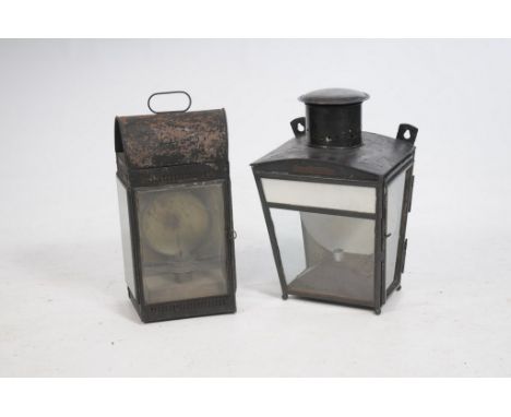 A Victorian black painted station lampOf rectangular form, glass panelled sides, a pierced gallery, looped carry handle and i