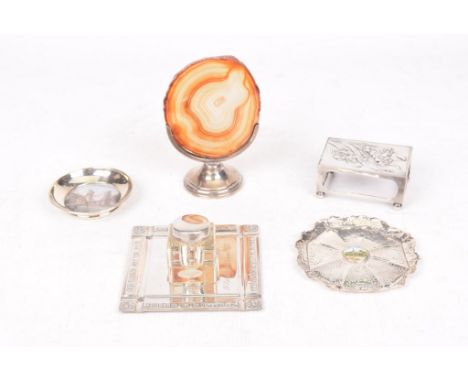 A silver inkstandOf square form, with embossed writing, central square receiver with a silver topped glass ink bottle, by Elk