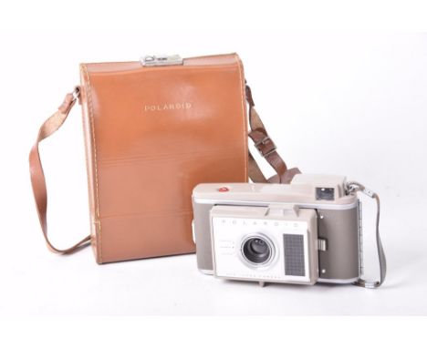 A cased Polaroid model J33 electric eye land camera kitIn brown leather case with original box and instruction leaflets.