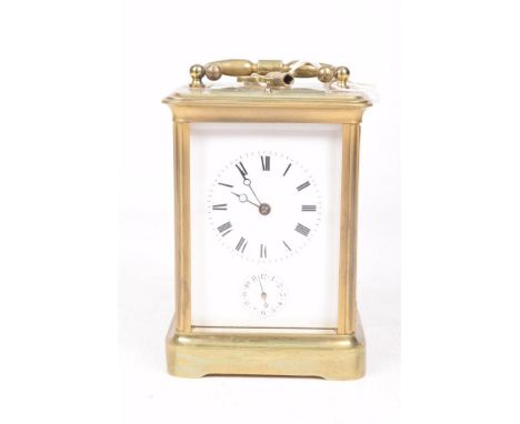 A late 19th Century French carriage clockThe brass corniche case with four glass sides enclosing white face with black Roman 