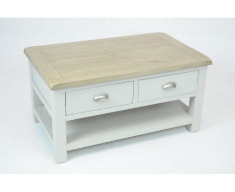 A modern painted and light oak centre tableWith a light oak slab top above two pairs of opposing painted frieze drawers  each