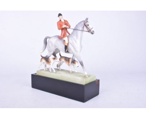 A Royal Worcester "Huntsman and Hounds" figure group, modelled by Doris LinderModel number 3115, mounted on black plinth base