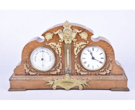 A late Victorian oak brass bound clock barometerThe arched case with twin white enamelled dials and central mercury thermomet