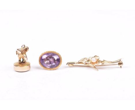 A 9ct gold and cultured pearl floral bar broochTogether with, a 9ct gold and amethyst fob, with engraved scroll decoration, a