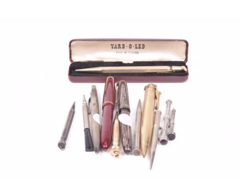 A collection of various pens and pencilsA gold plated pencil, with engine turned decoration, cased, together with, a gold pla