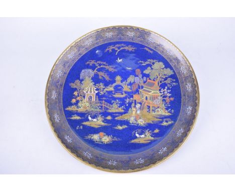 A Carlton Ware "Mikado" pattern wall chargerOf circular form, detailed in enamels and gilt depicting pavilions and Chinese la