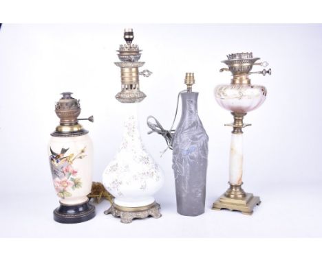 A mixed collection of table and oil lampsTo include a white glazed oil lamp base (converted to electricity), a cast pewter ty